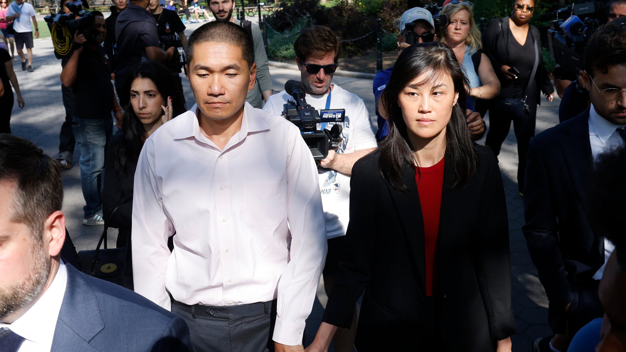 Former New York Governor Kathy Hochul aide Linda Sun, right, and her husband, Christopher Hu leave Brooklyn Federal Court after their arraignment, Tuesday, Sept. 3, 2024, in New York. Sun is charged with being an aide to the Chinese government. (AP Photo/Corey Sipkin)