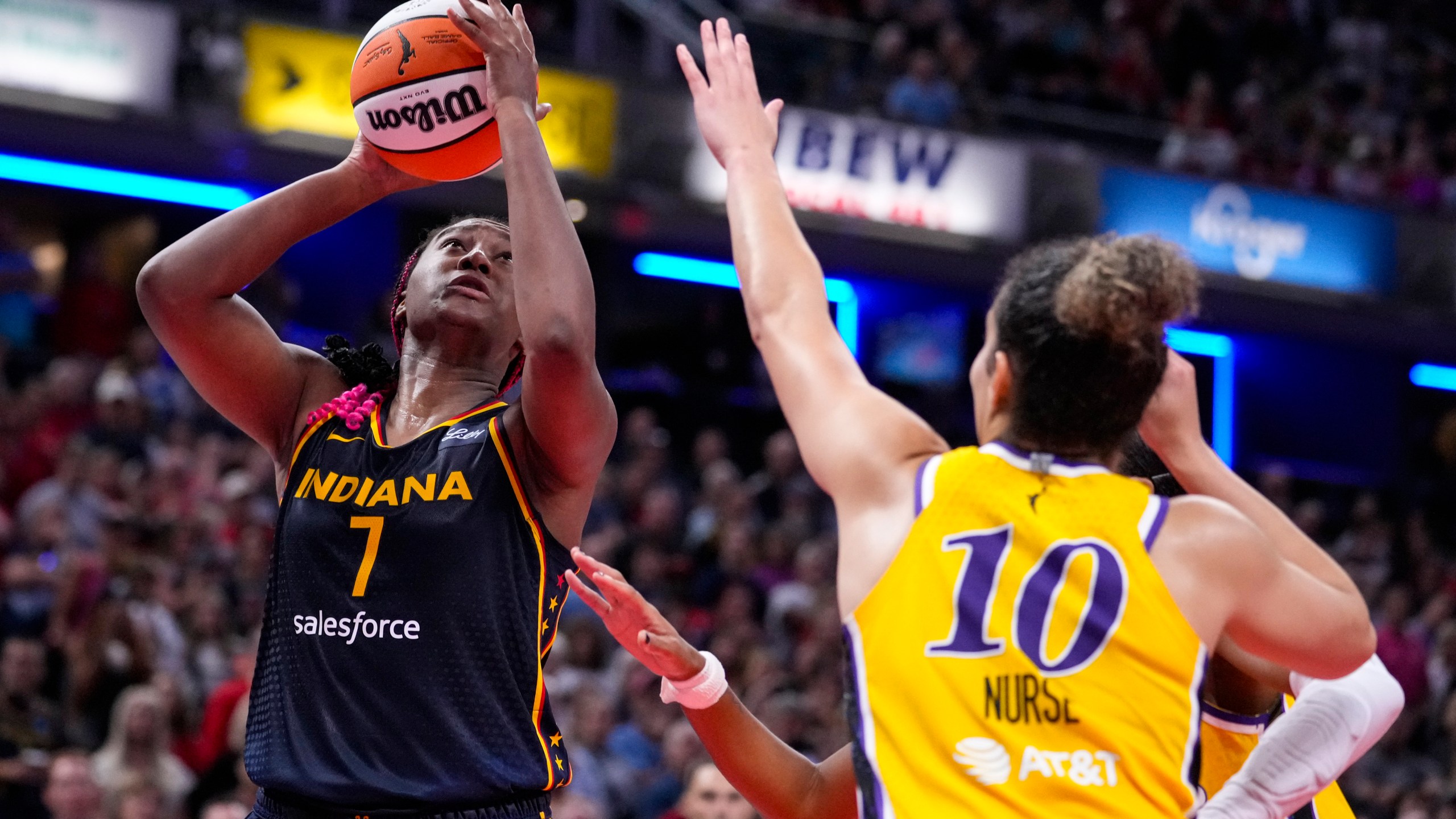 Indiana Fever forward Aliyah Boston (7) shoots over Los Angeles Sparks guard Kia Nurse (10) in the second half of a WNBA basketball game in Indianapolis, Wednesday, Sept. 4, 2024. (AP Photo/Michael Conroy)