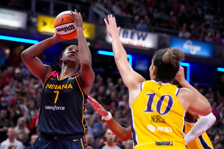 Indiana Fever forward Aliyah Boston (7) shoots over Los Angeles Sparks guard Kia Nurse (10) in the second half of a WNBA basketball game in Indianapolis, Wednesday, Sept. 4, 2024. (AP Photo/Michael Conroy)