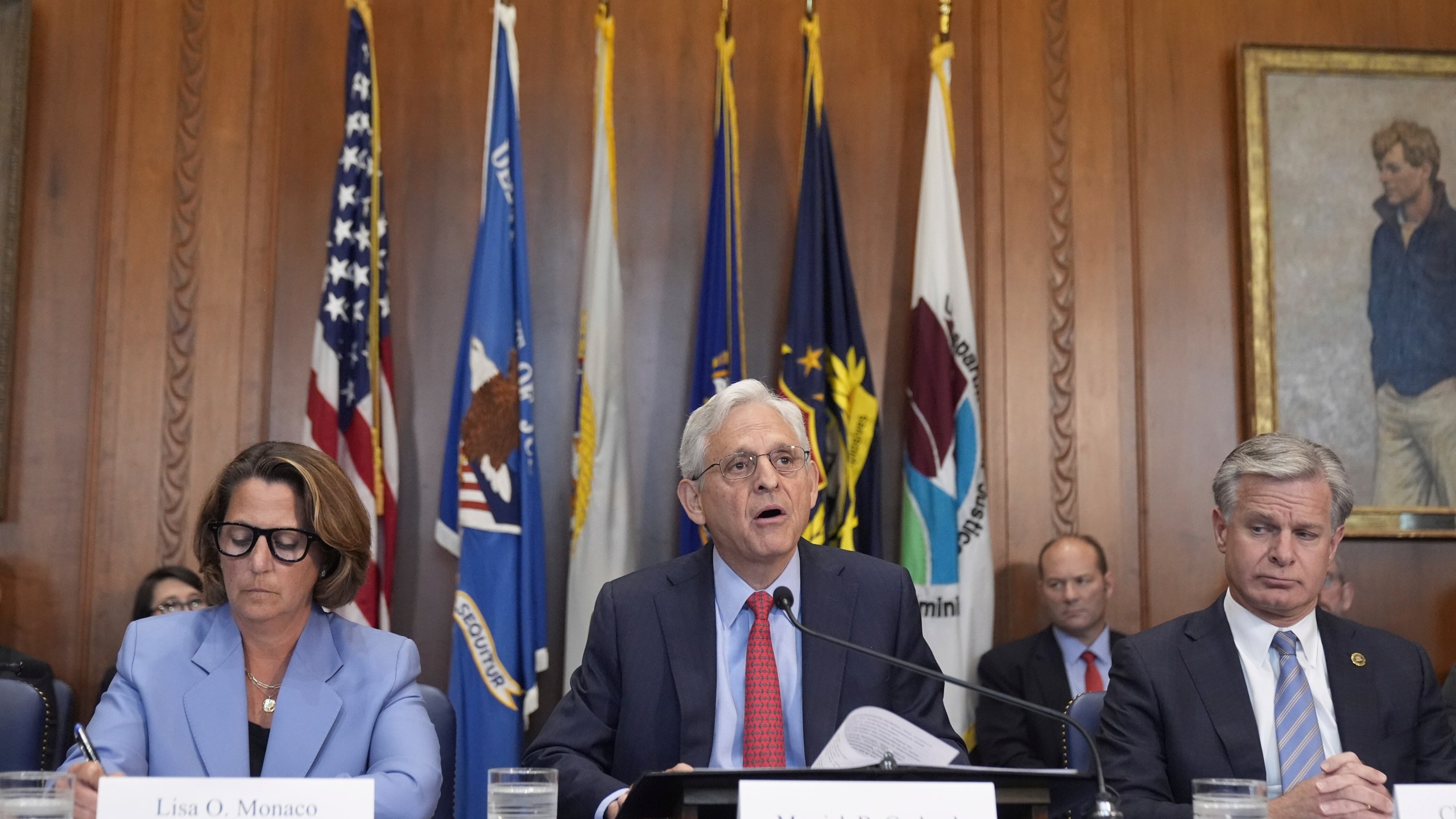 Attorney General Merrick Garland speaks during a meeting of the Justice Department's Election Threats Task Force, at the Department of Justice, Wednesday, Sept. 4, 2024, in Washington, with Deputy Attorney General Lisa Monaco, left, and FBI Director Christopher Wray, right. (AP Photo/Mark Schiefelbein)