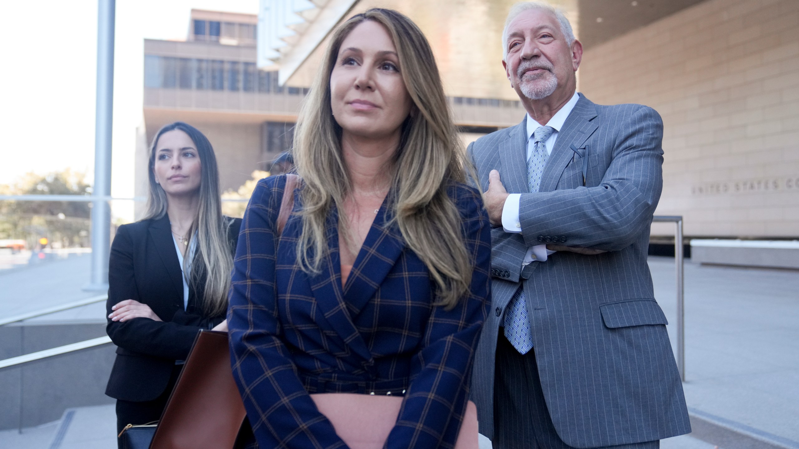 Members of Hunter Biden's defense team stand outside federal court after Biden pleaded guilty in his felony federal tax case, Thursday, Sept. 5, 2024, in Los Angeles. (AP Photo/Eric Thayer)