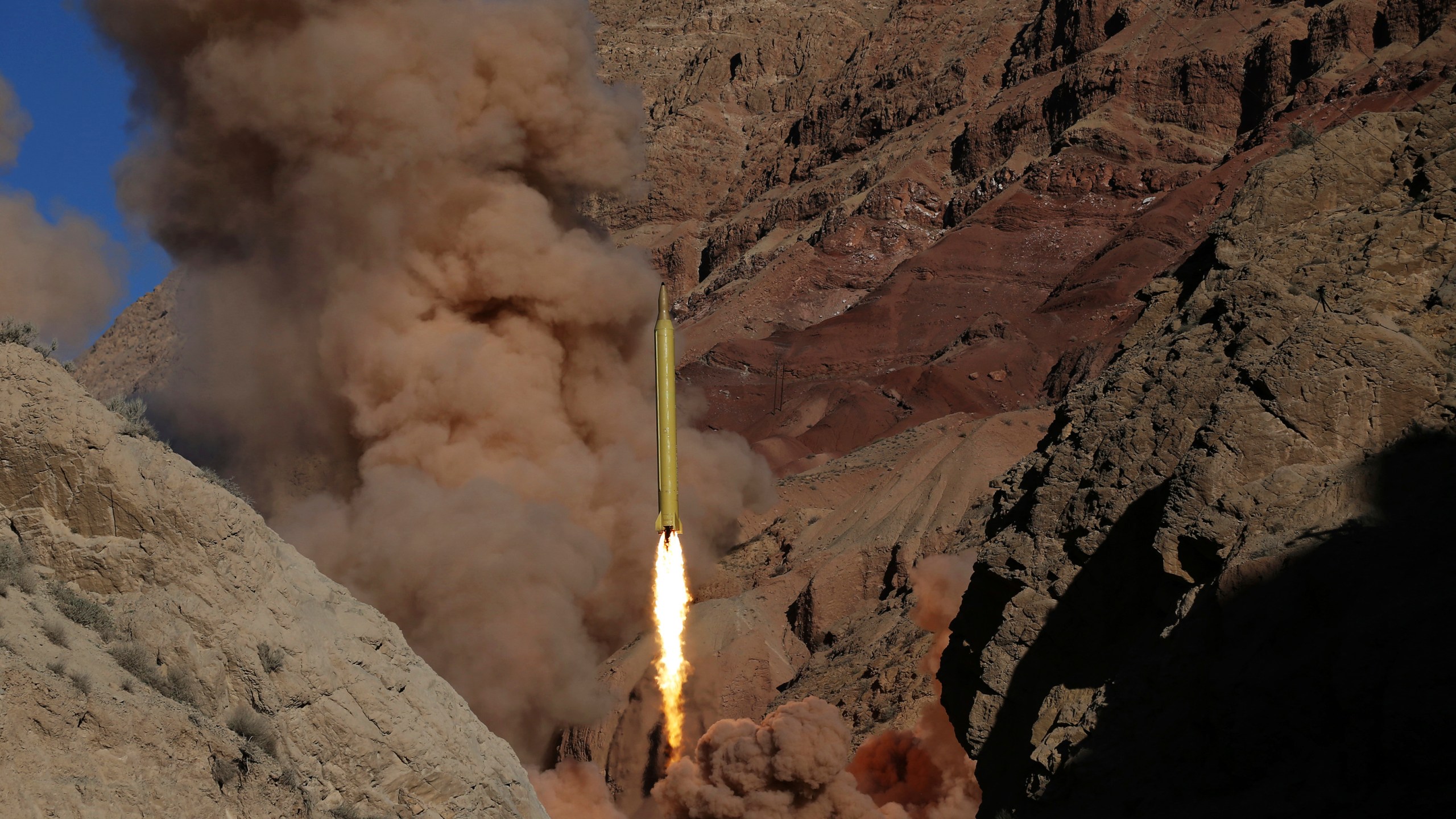 FILE - A Qadr H long-range ballistic surface-to-surface missile is fired by Iran's Revolutionary Guard during a maneuver in an undisclosed location in Iran, on March 9, 2016. (AP Photo/Omid Vahabzadeh, File)