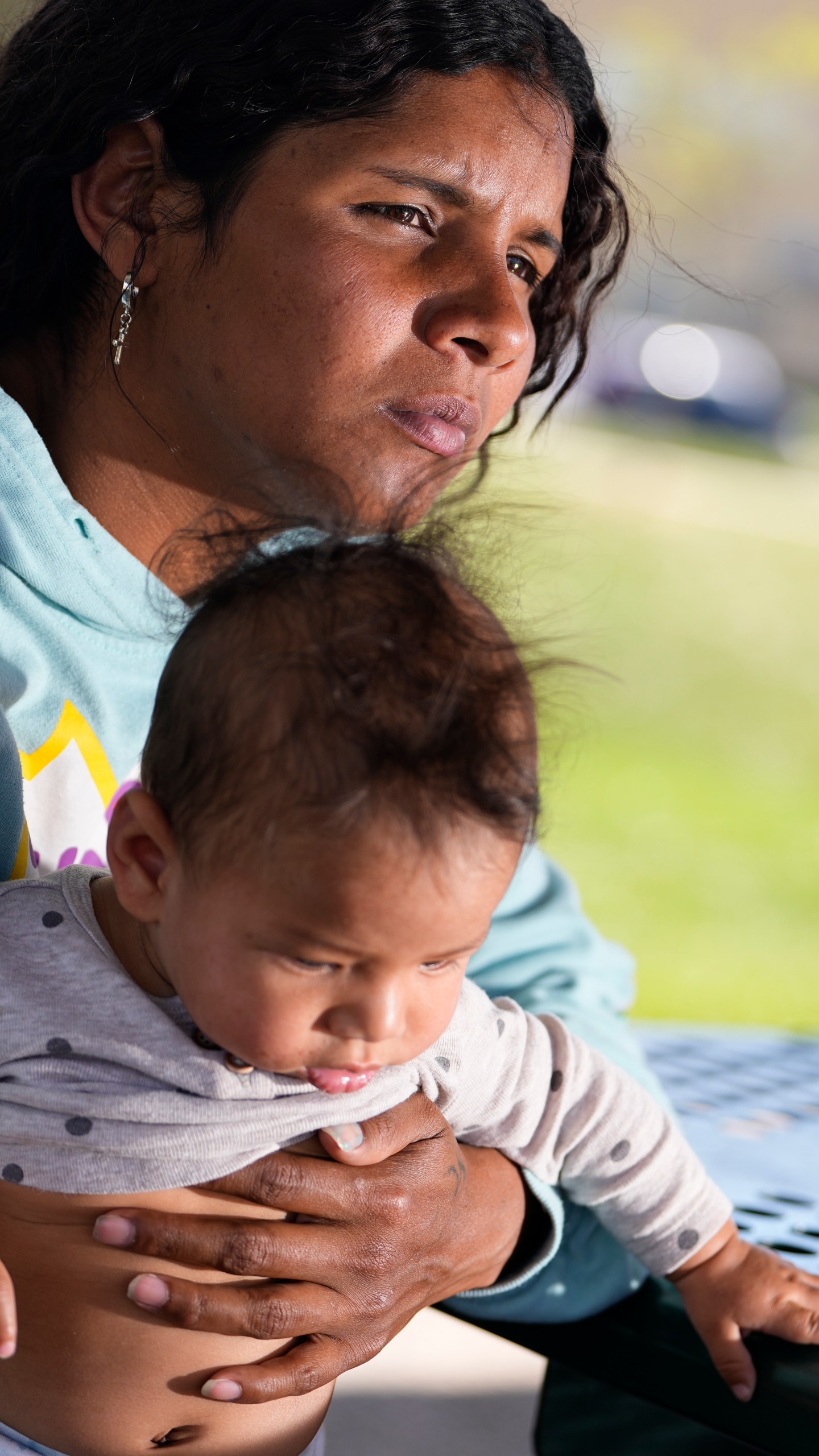 Ivanni Herrera holds her baby Milan Guzman during an interview in a park Friday, May 18, 2024, in Aurora, Colo. (AP Photo/Jack Dempsey)