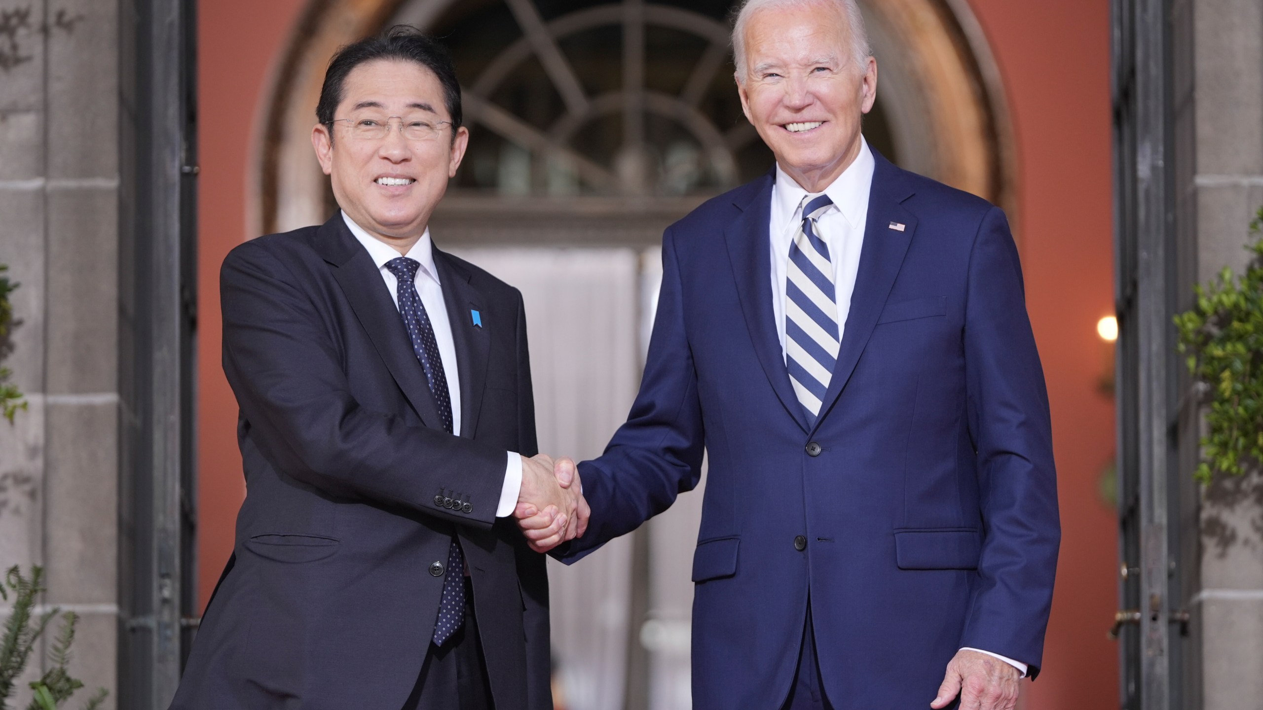 President Joe Biden greets Japan's Prime Minister Fumio Kishida at the Quad leaders summit at Archmere Academy in Claymont, Del., Saturday, Sept. 21, 2024. (AP Photo/Mark Schiefelbein)