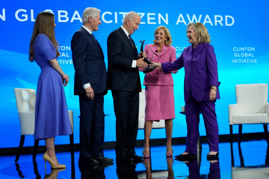 President Joe Biden is presented with the Global Citizen Award by Chelsea Clinton, former President Bill Clinton, first lady Jill Biden and former Secretary of State Hillary Clinton at the Clinton Global Initiative Monday, Sept. 23, 2024, in New York. (AP Photo/Manuel Balce Ceneta)