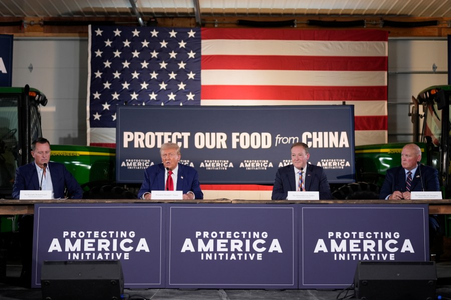 Republican presidential nominee former President Donald Trump speaks at a campaign event at a farm, Monday, Sept. 23, 2024, in Smithton, Pa, as from left, Richard Grenell, Lee Zeldin and Rep. Glenn Thompson, R-Pa., listen. (AP Photo/Alex Brandon)