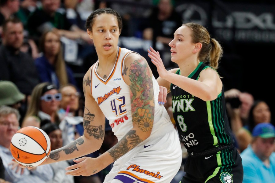 Phoenix Mercury center Brittney Griner (42) works around Minnesota Lynx forward Alanna Smith (8) in the first quarter of Game 2 of a WNBA basketball first-round playoff game, Wednesday, Sept. 25, 2024, in Minneapolis. (AP Photo/Bruce Kluckhohn)