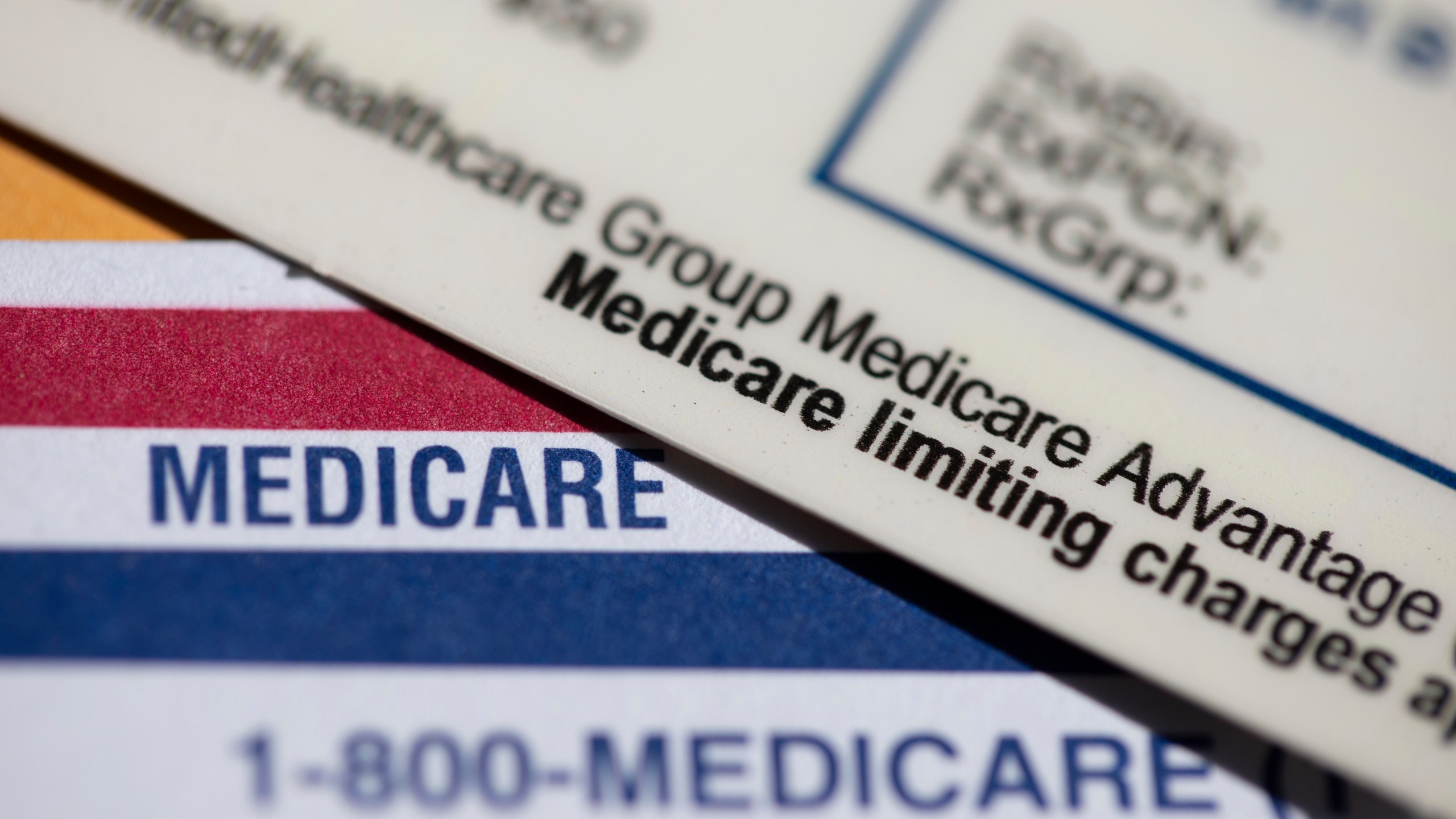 FILE - A UnitedHealthcare Group Medicare Advantage PPO card rests on top of a Medicare card is seen in Portland, Ore., June 10, 2024. (AP Photo/Jenny Kane, File)