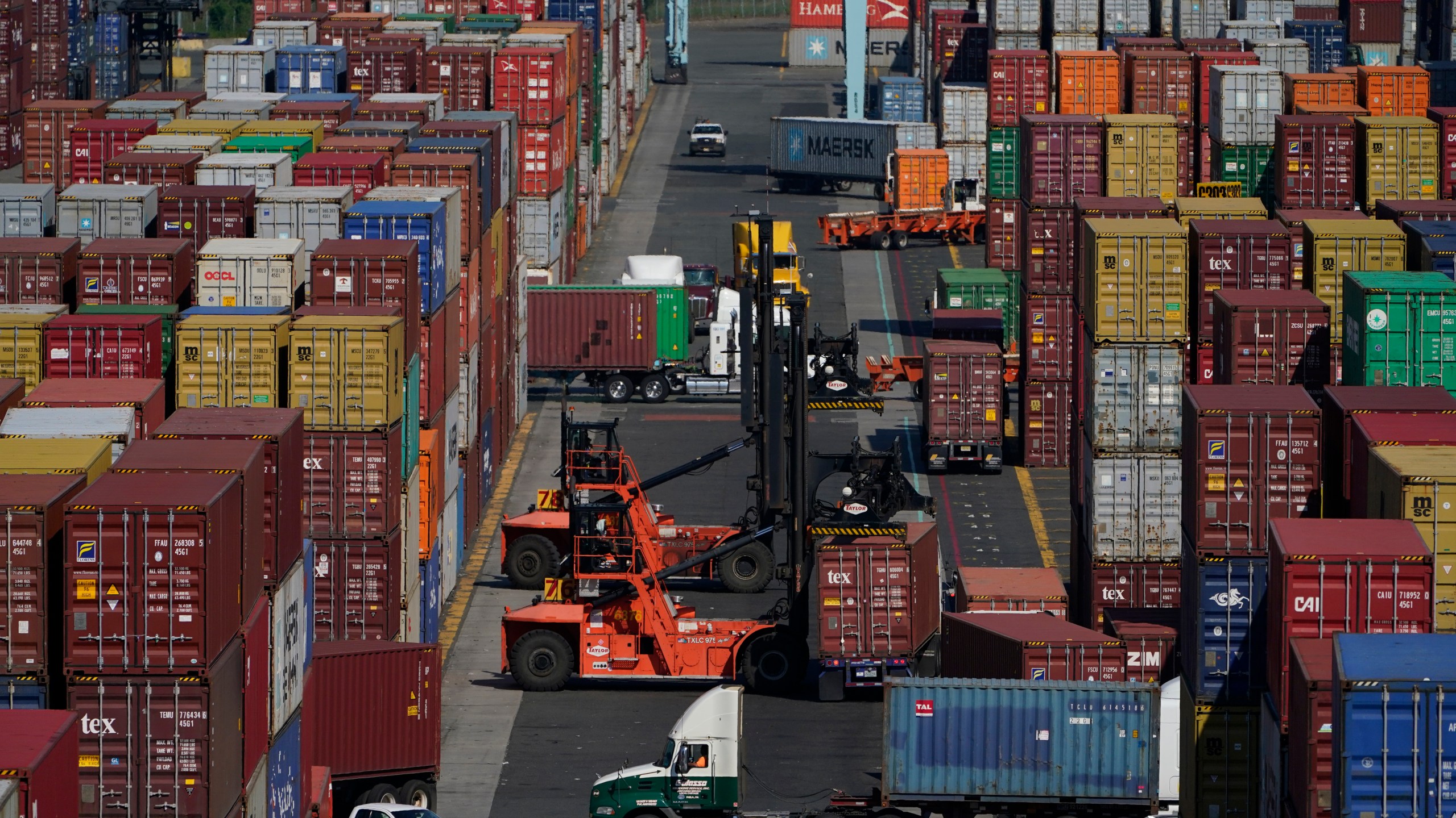 FILE - Containers are moved at the Port of New York and New Jersey in Elizabeth, N.J., on June 30, 2021. (AP Photo/Seth Wenig, File)