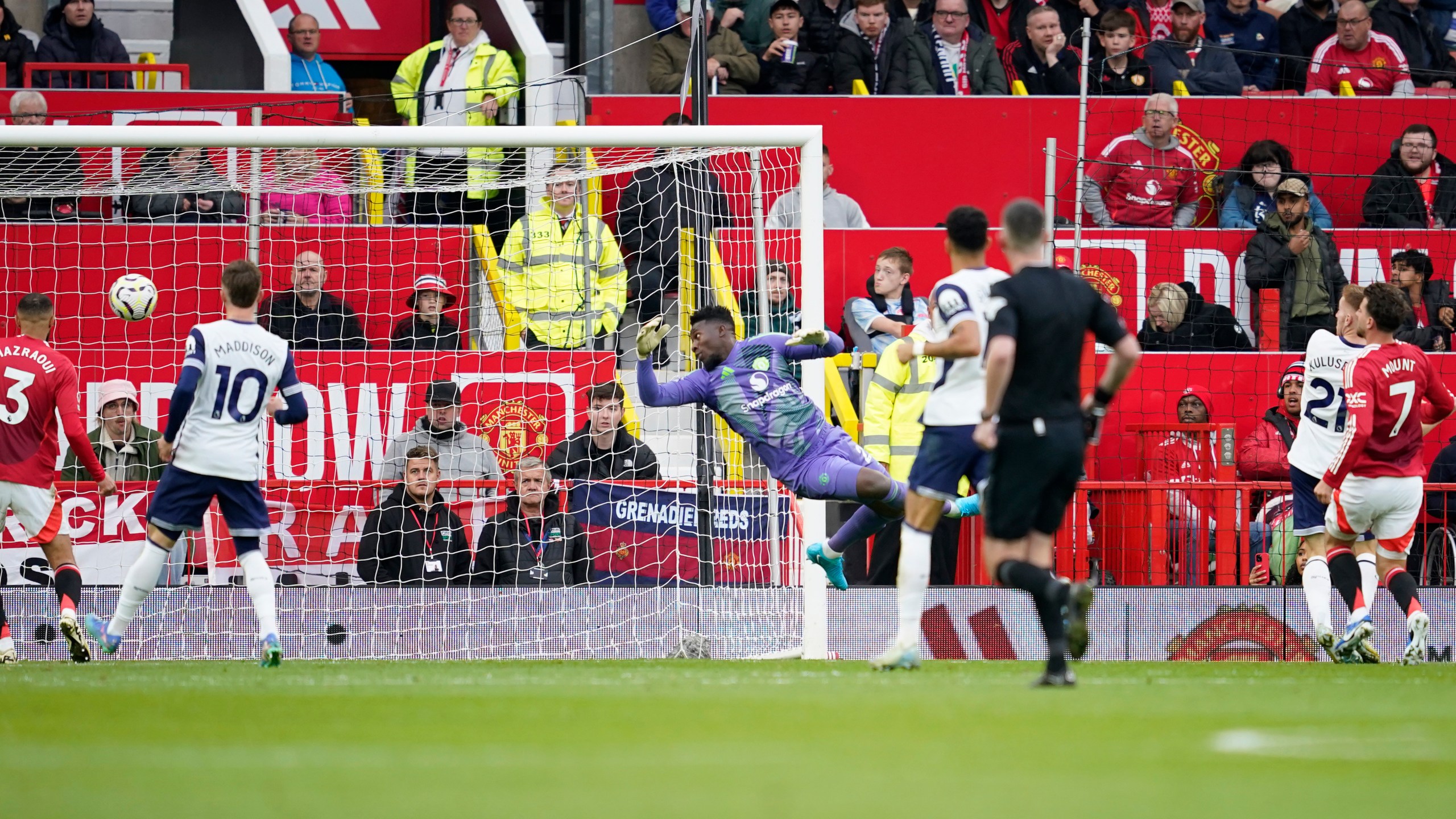 Tottenham's Dejan Kulusevski, second right, scores his side's second goal during the English Premier League soccer match between Manchester United and Tottenham Hotspur at Old Trafford stadium in Manchester, England, Sunday, Sept. 29, 2024. (AP Photo/Dave Thompson)