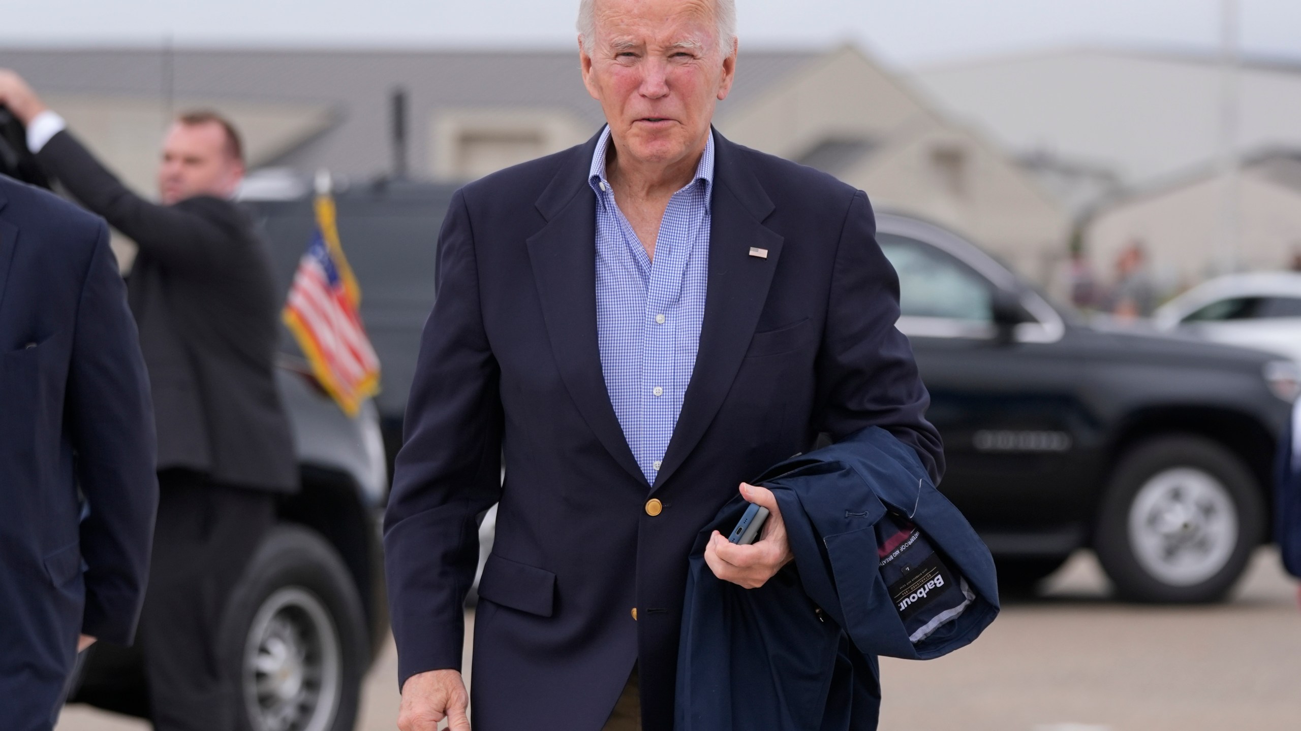 President Joe Biden speaks to reporters before boarding Air Force One at Dover Air Force Base, in Dover, Del., Sunday, Sept. 29, 2024, to return to Washington. (AP Photo/Manuel Balce Ceneta)