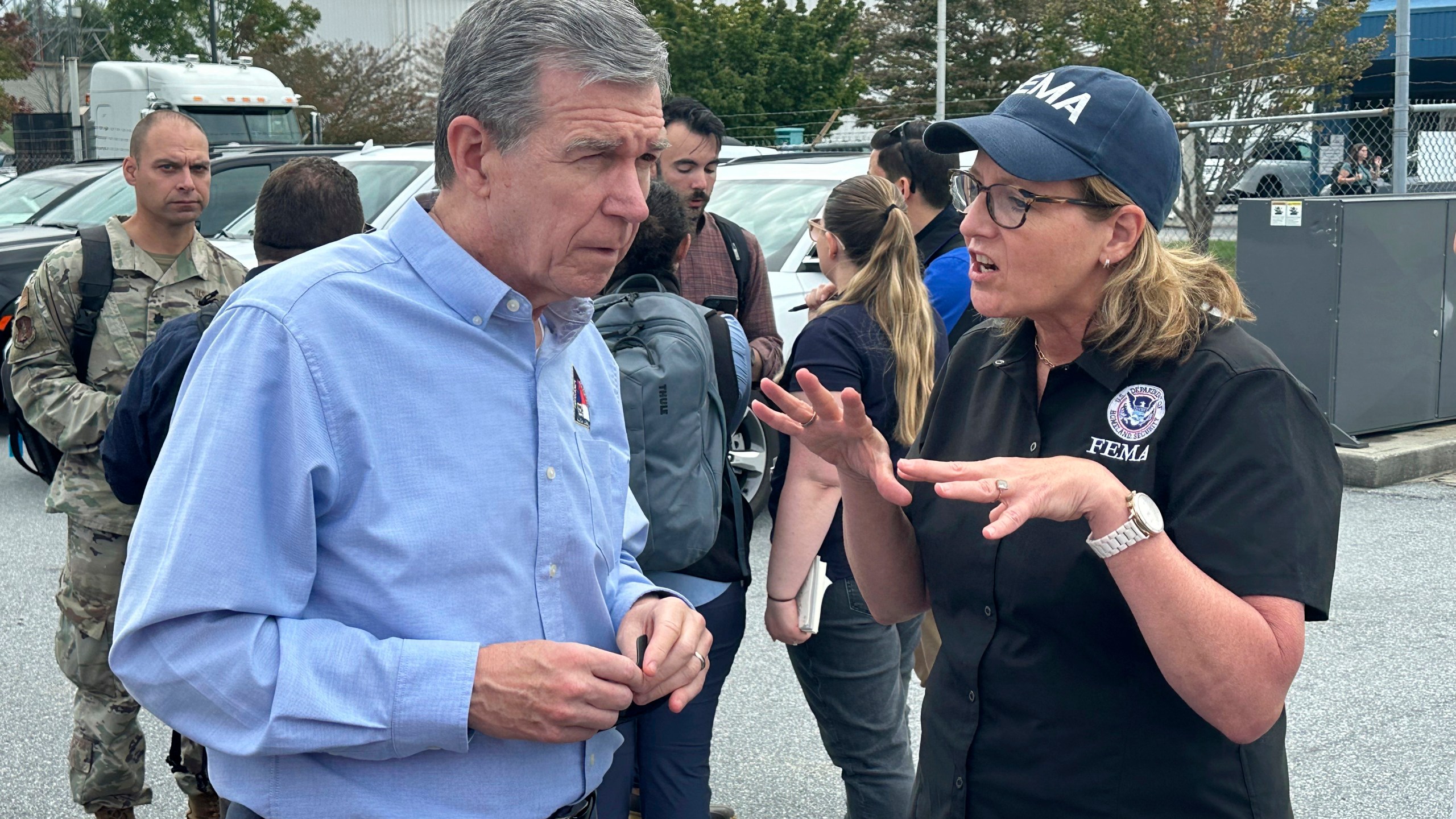 North Carolina Gov. Roy Cooper speaks with FEMA Administrator Deanne Criswell on Monday, Sept. 30, at the Asheville Regional Airport in Fletcher, N.C. (AP Photo/Gary Robertson)