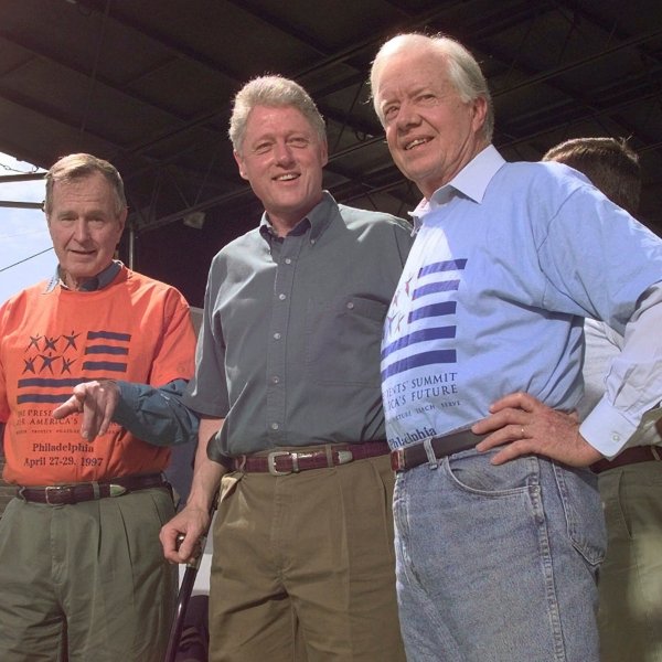 FILE - Former Presidents George Bush, left, and Jimmy Carter, right, stand with President Clinton during a kick-off rally for the President's volunteer summit at Marcus Foster Stadium in Philadelphia, PA., April 27, 1997. (AP Photo/Greg Gibson, File)