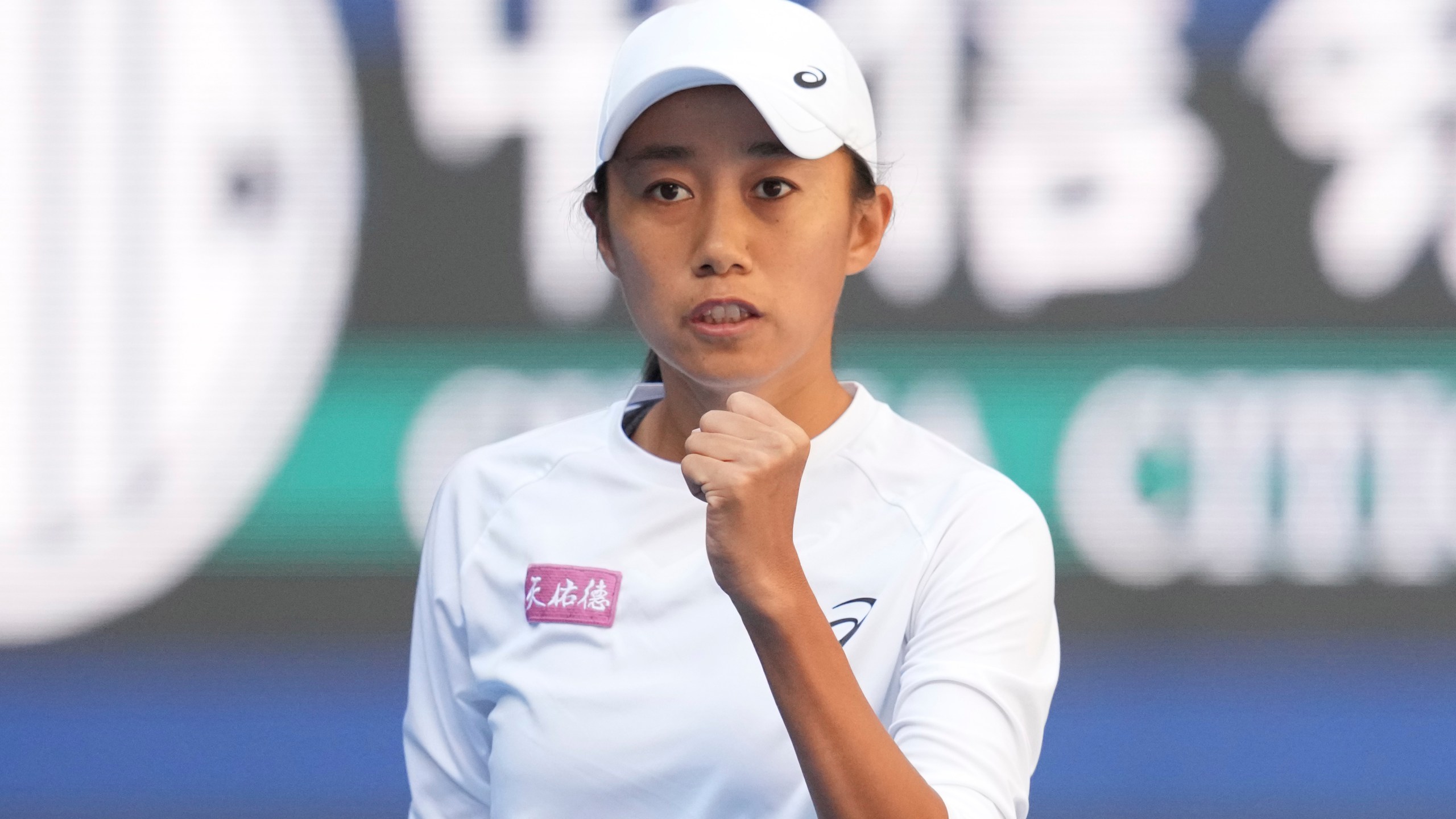 Zhang Shuai of China celebrates after winning a point against Magdalena Frech of Poland in women's singles match for the China Open tennis tournament at the national tennis center in Beijing, Tuesday, Oct. 1, 2024. (AP Photo/Achmad Ibrahim)