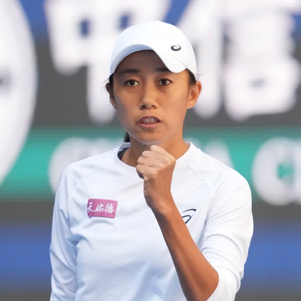 Zhang Shuai of China celebrates after winning a point against Magdalena Frech of Poland in women's singles match for the China Open tennis tournament at the national tennis center in Beijing, Tuesday, Oct. 1, 2024. (AP Photo/Achmad Ibrahim)