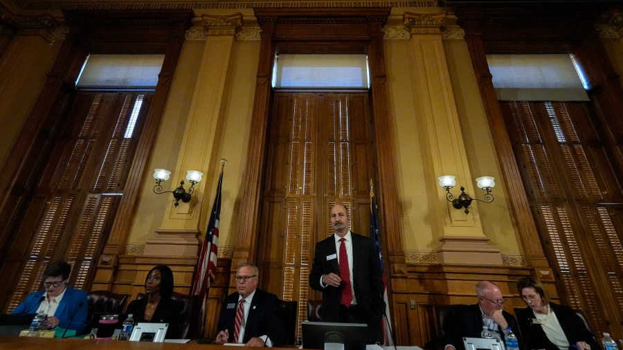 Georgia's State Election Board members discuss proposals for election rule changes at the state capitol, Friday, Sept. 20, 2024, in Atlanta. (AP Photo/Mike Stewart)