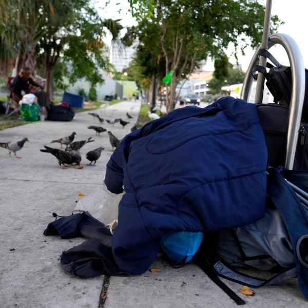 The belongings of a homeless person are piled on the sidewalk on the first day of a statute that took effect, making it illegal in Florida to sleep on sidewalks, in parks, on beaches or in other public spaces — one of the country's strictest anti-homelessness laws, Tuesday, Oct. 1, 2024, in Fort Lauderdale, Fla. (AP Photo/Lynne Sladky)