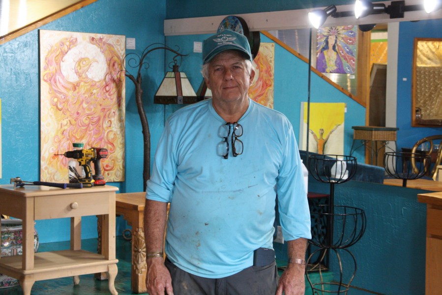 Freddie Pell stands in his art gallery in downtown Boone, N.C., that was flooded when Tropical Storm Helene passed over western North Carolina, Monday, Sept. 30, 2024. (AP Photo/Makiya Seminera)