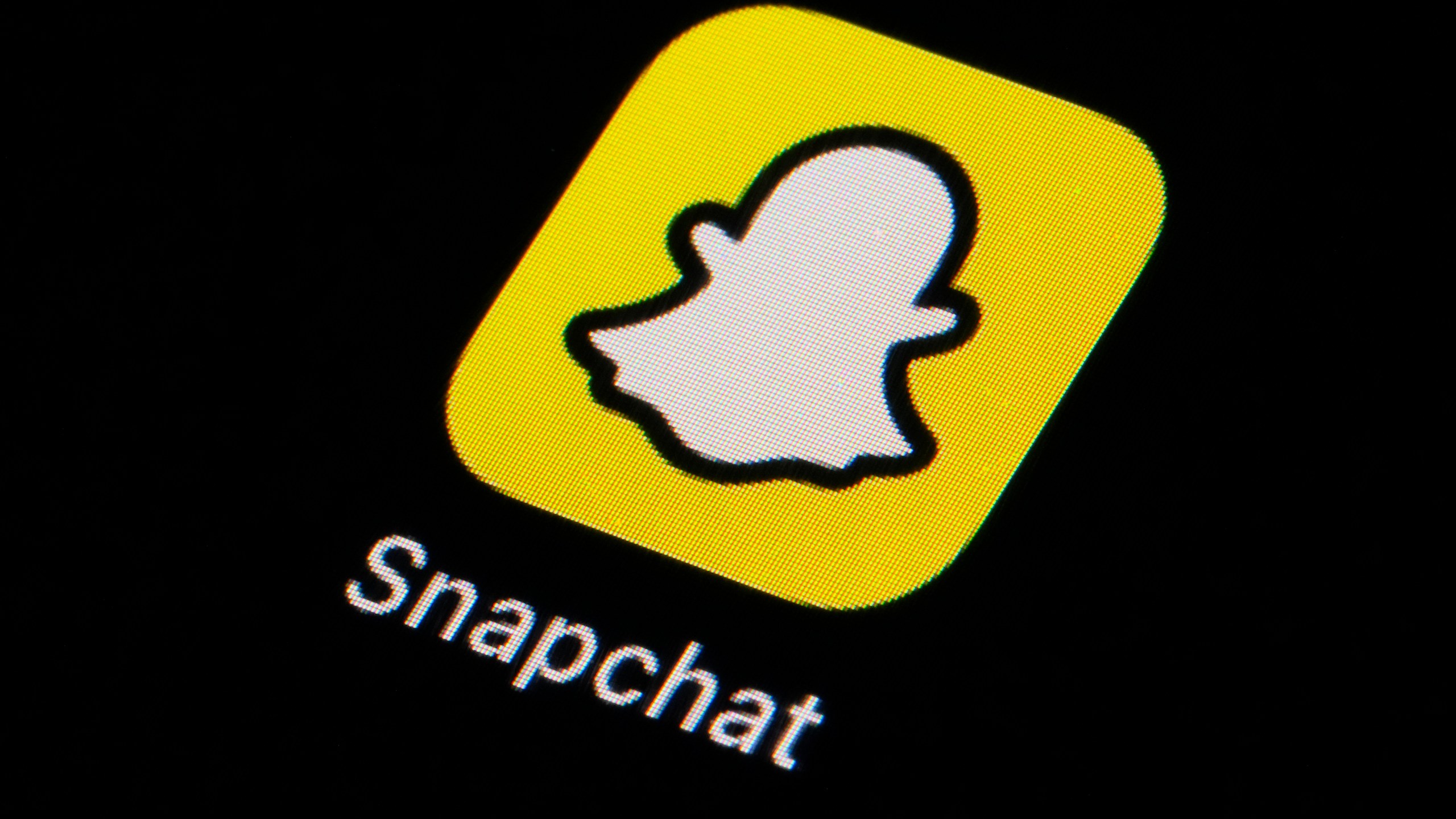 FILE - The icon for Snapchat is seen on a smartphone, Feb. 28, 2023, in Marple Township, Pa. (AP Photo/Matt Slocum, File)