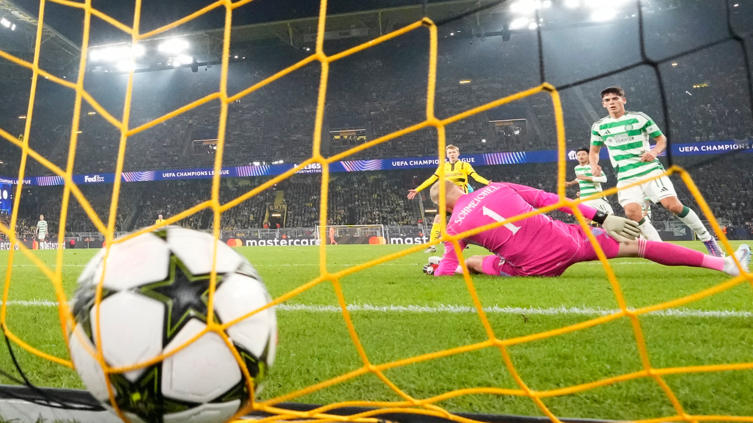 Celtic's goalkeeper Kasper Schmeichel receives the 6th goal by Dortmund's Serhou Guirassy during the Champions League opening phase soccer match between Borussia Dortmund and Celtic FC at the BVB Stadion in Dortmund, Tuesday, Oct. 1, 2024. (AP Photo/Martin Meissner)