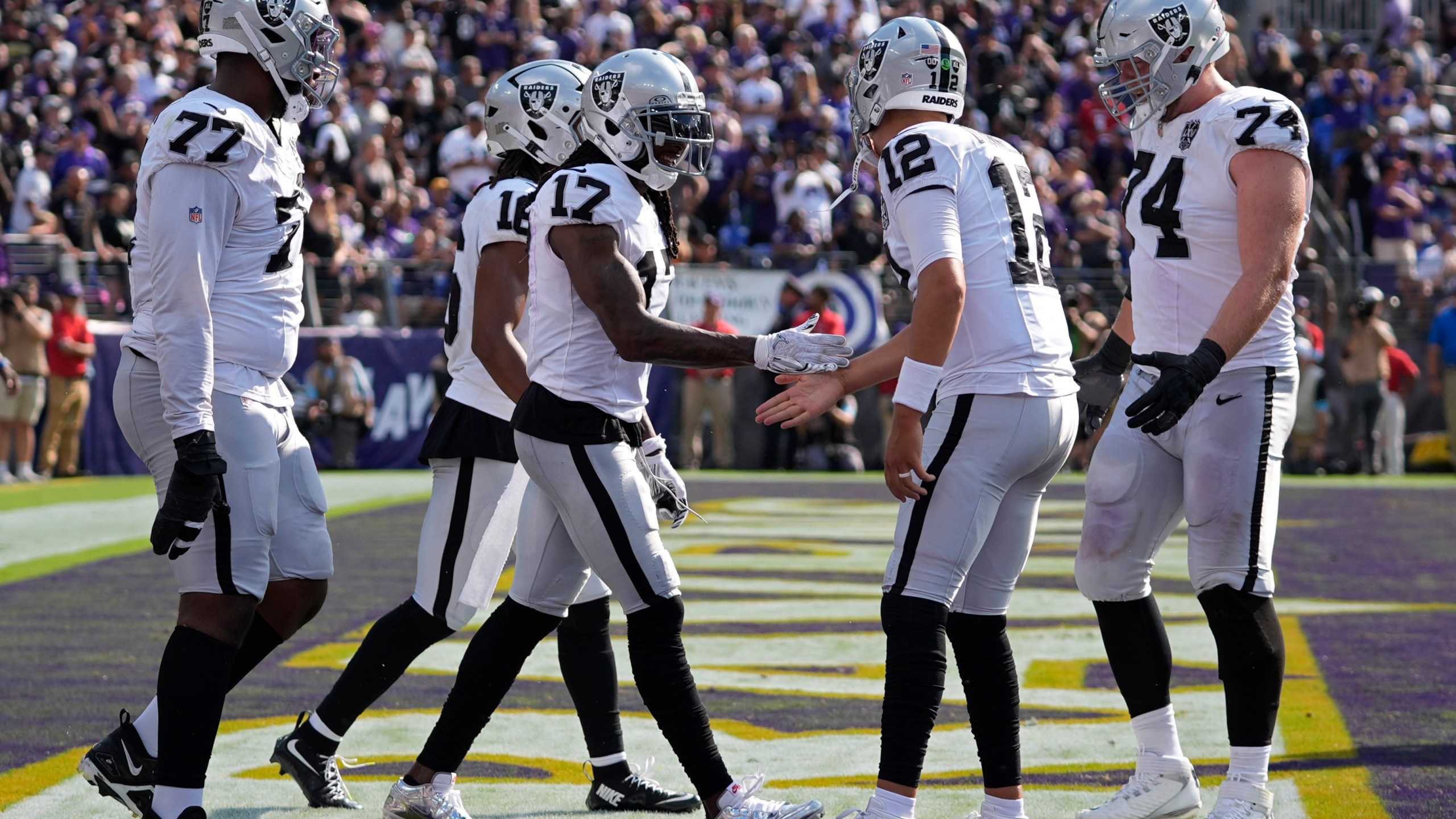 Las Vegas Raiders wide receiver Davante Adams (17) celebrates after scoring a touchdown against the Baltimore Ravens during the second half of an NFL football game, Sunday, Sept. 15, 2024, in Baltimore. (AP Photo/Stephanie Scarbrough)