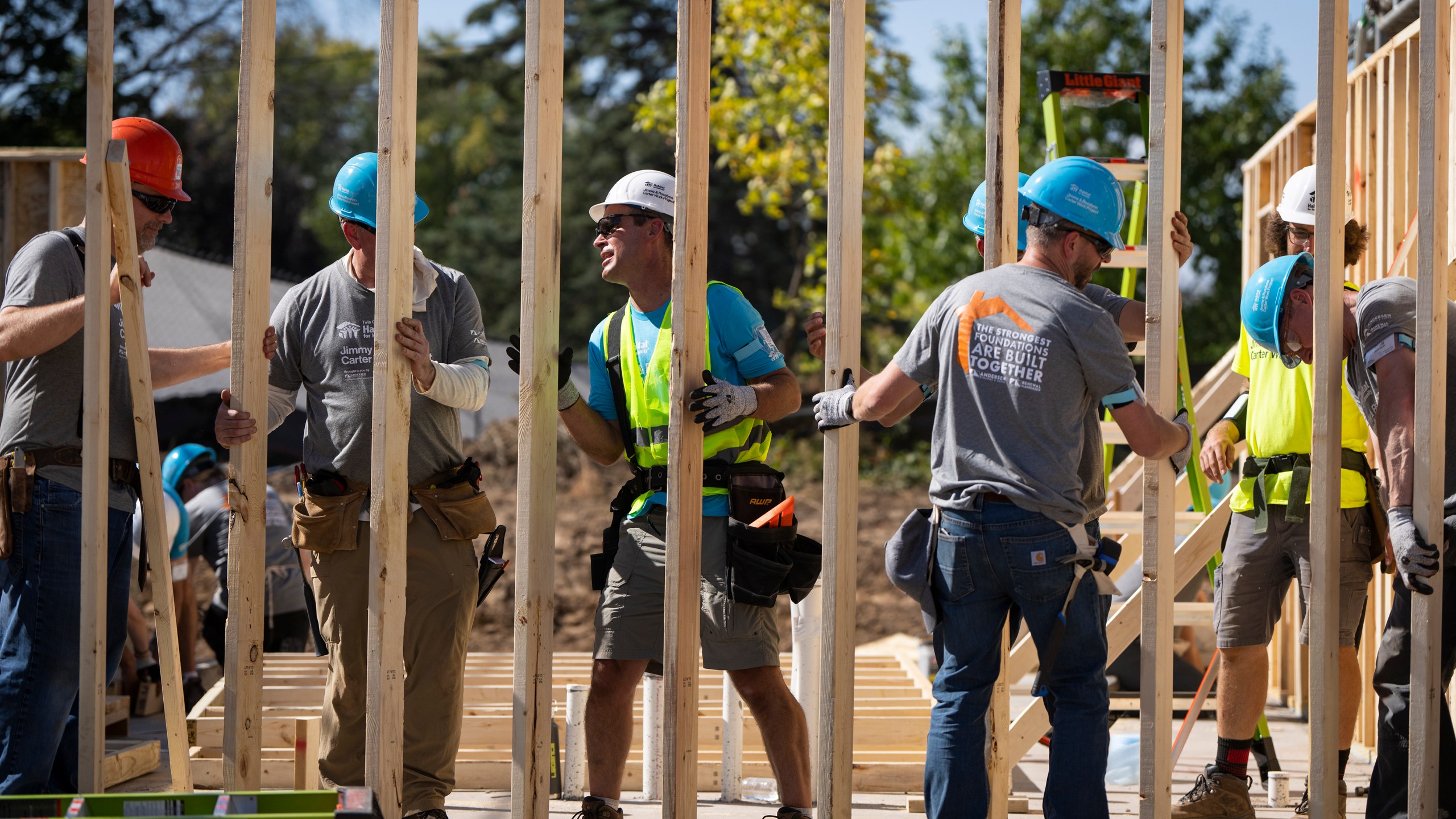 Volunteers build houses during Twin Cities Habitat for Humanity's 2024 Jimmy & Rosalynn Carter Work Project at the site of the former Hillcrest Golf Course in St. Paul, Minn. on Monday, Sept. 30, 2024. (Leila Navidi /Star Tribune via AP)