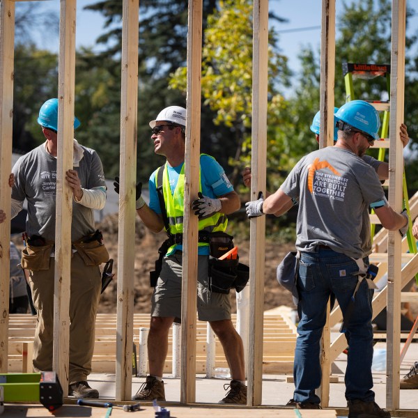 Volunteers build houses during Twin Cities Habitat for Humanity's 2024 Jimmy & Rosalynn Carter Work Project at the site of the former Hillcrest Golf Course in St. Paul, Minn. on Monday, Sept. 30, 2024. (Leila Navidi /Star Tribune via AP)