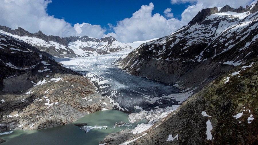 FILE - A lake of meltwater has formed on the tongue of the Rhone Glacier near Goms, Switzerland, June 13, 2023. (AP Photo/Matthias Schrader, File)