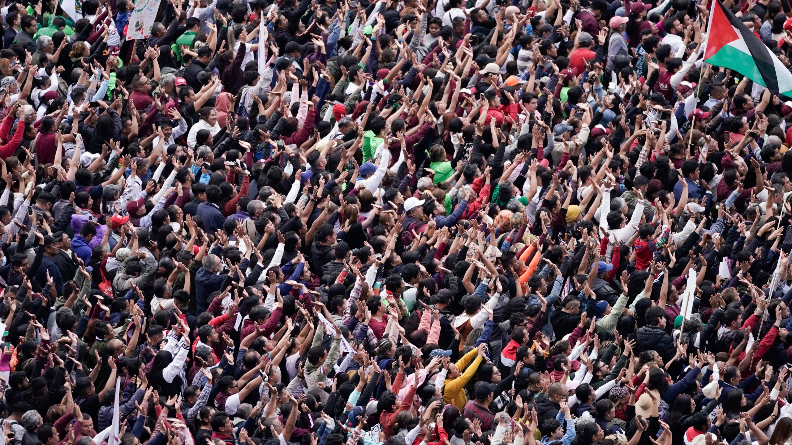 Supporters listen to President Claudia Sheinbaum during a rally in the Zócalo, Mexico City's main square, on her inauguration day, Tuesday, Oct. 1, 2024. (AP Photo/Aurea Del Rosario)