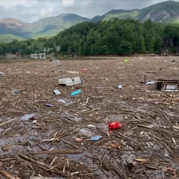 Flood debris from Hurricane Helene floats by in Rutherford County, N.C., Sunday, Sept. 29, 2024. (Tariq Bokhari via AP)