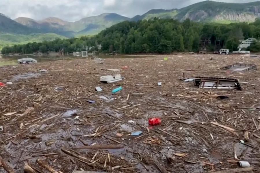 Flood debris from Hurricane Helene floats by in Rutherford County, N.C., Sunday, Sept. 29, 2024. (Tariq Bokhari via AP)