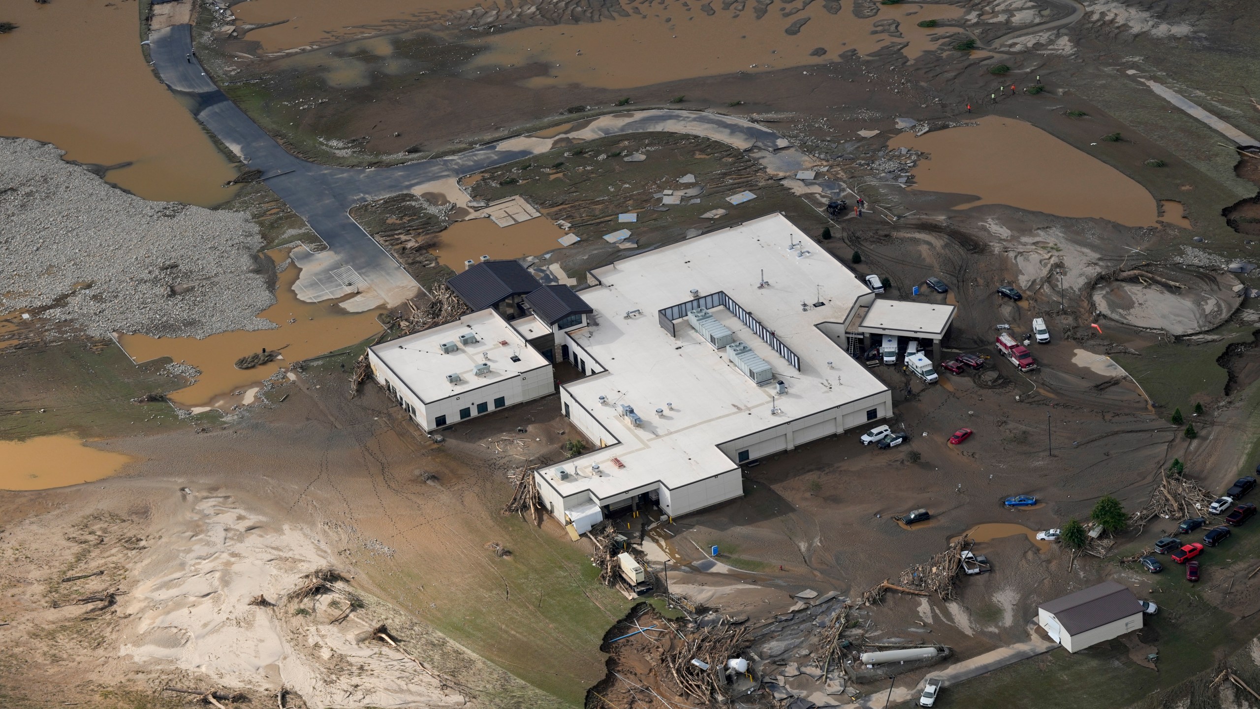 An aerial view of flood-damaged Unicoi County Hospital in the aftermath of Hurricane Helene, Saturday, Sept. 28, 2024, in Erwin, Tenn. (AP Photo/George Walker IV)