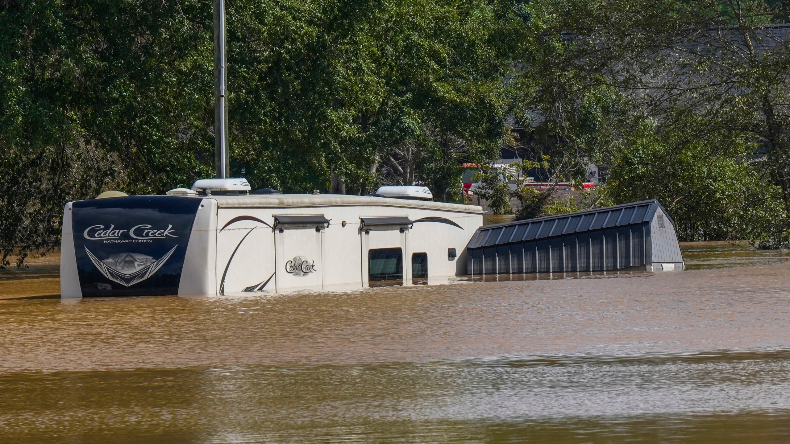 FILE - The Riverside RV park was flooded from the overflowing Catawba River after torrential rain from Hurricane Helene, Sept. 28, 2024, in Morganton, N.C. (AP Photo/Kathy Kmonicek, File)