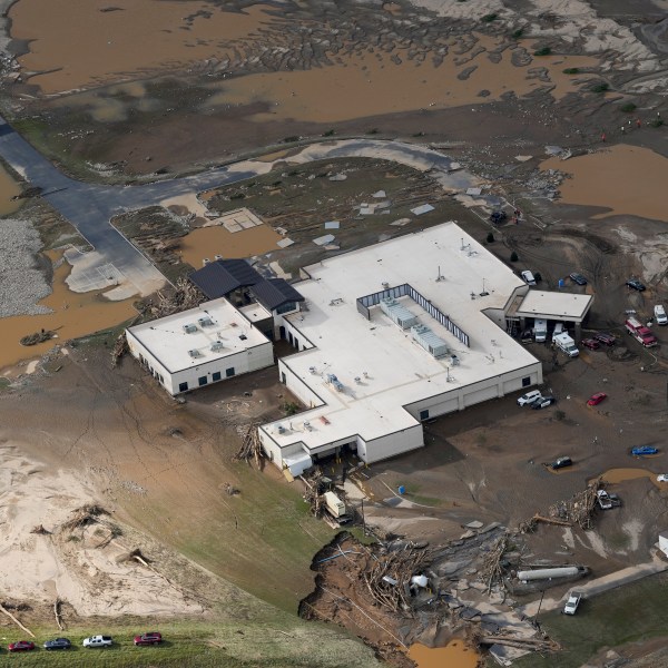 An aerial view of flood-damaged Unicoi County Hospital in the aftermath of Hurricane Helene, Saturday, Sept. 28, 2024, in Erwin, Tenn. (AP Photo/George Walker IV)