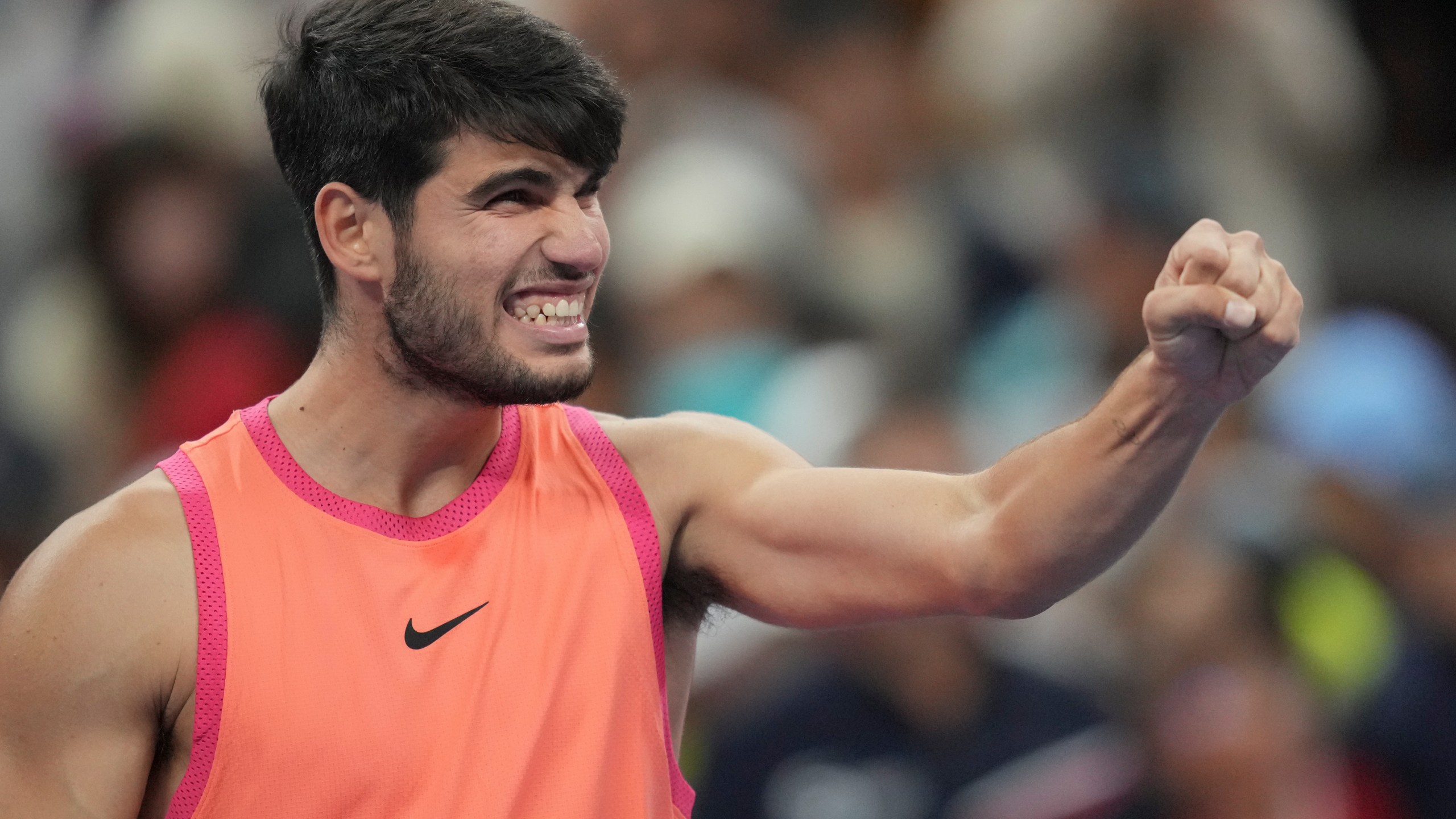 Carlos Alcaraz of Spain reacts after winning against Jannik Sinner of Italy during their men's singles finals match of the China Open tennis tournament, at the National Tennis Center in Beijing, Wednesday, Oct. 2, 2024. (AP Photo/Achmad Ibrahim)