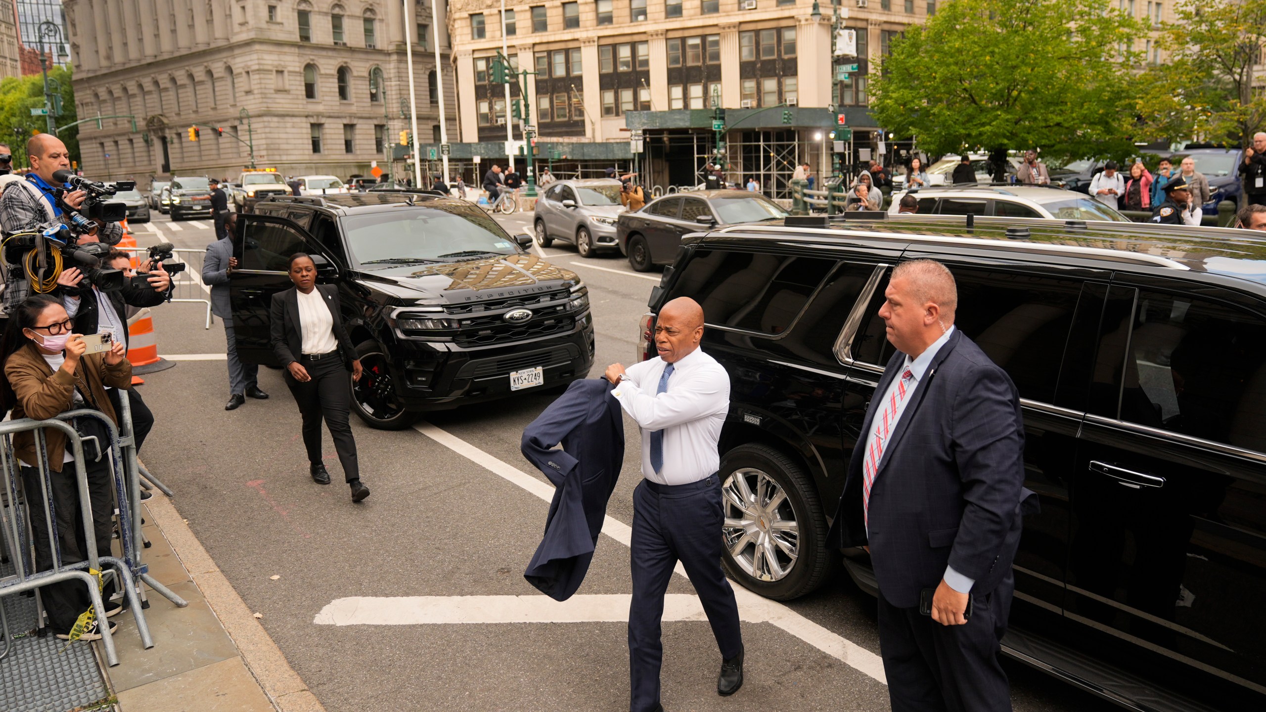 New York City Mayor Eric Adams, second from right, arrives to court in New York, Wednesday, Oct. 2, 2024. (AP Photo/Seth Wenig)