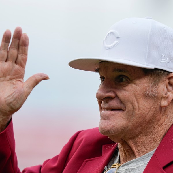 FILE - Former Cincinnati Reds player Pete Rose waves to fans after being introduced during the Reds Hall of Fame Induction Ceremony, July 15, 2023, in Cincinnati. (AP Photo/Darron Cummings, File)