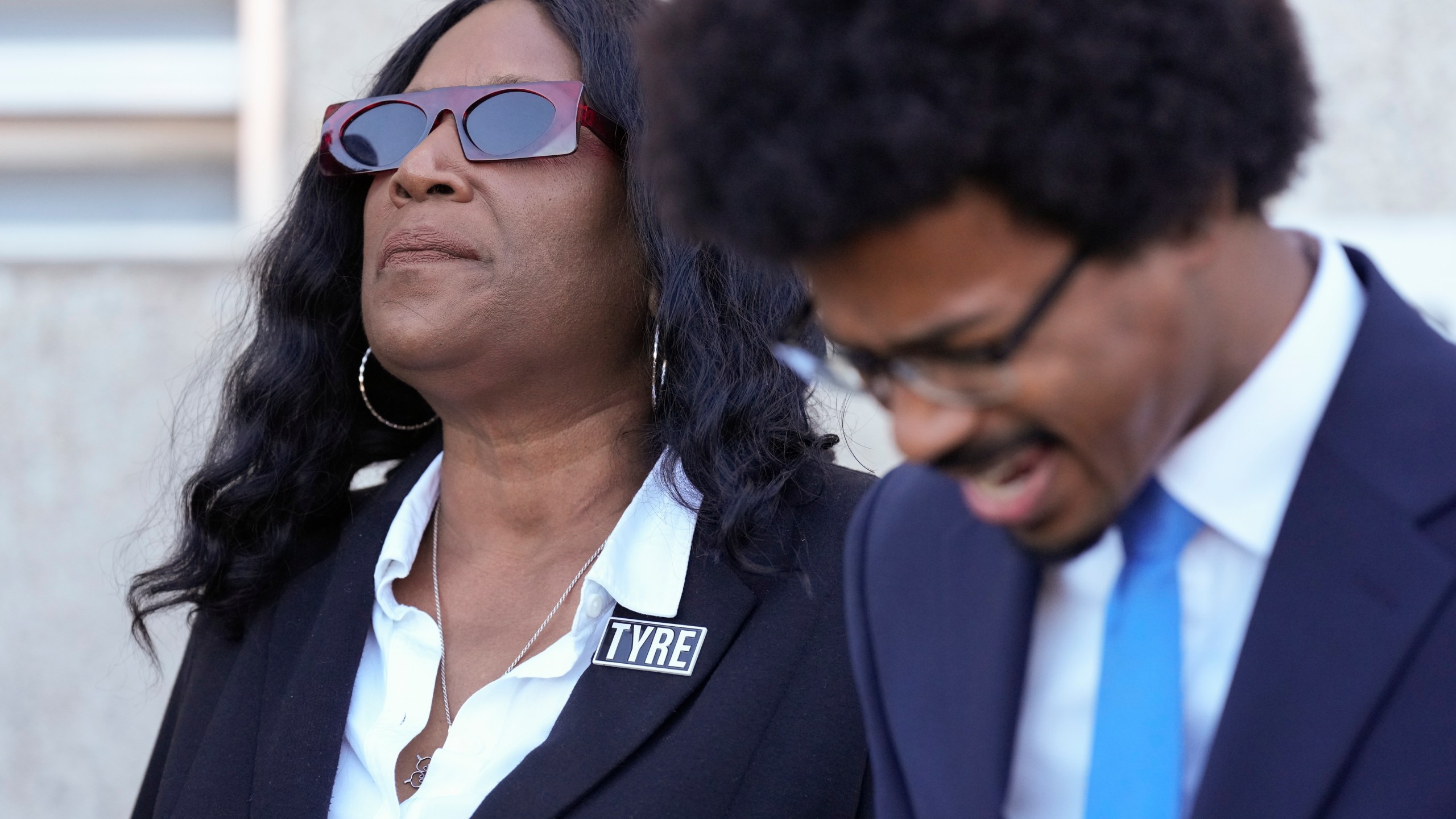 RowVaughn Wells, left, mother of Tyre Nichols, prays with Rep. Justin J. Pearson, D-Memphis, right, before entering the federal courthouse for the trial of three former Memphis police officers charged in the 2023 fatal beating of her son Wednesday, Oct. 2, 2024, in Memphis, Tenn. (AP Photo/George Walker IV)