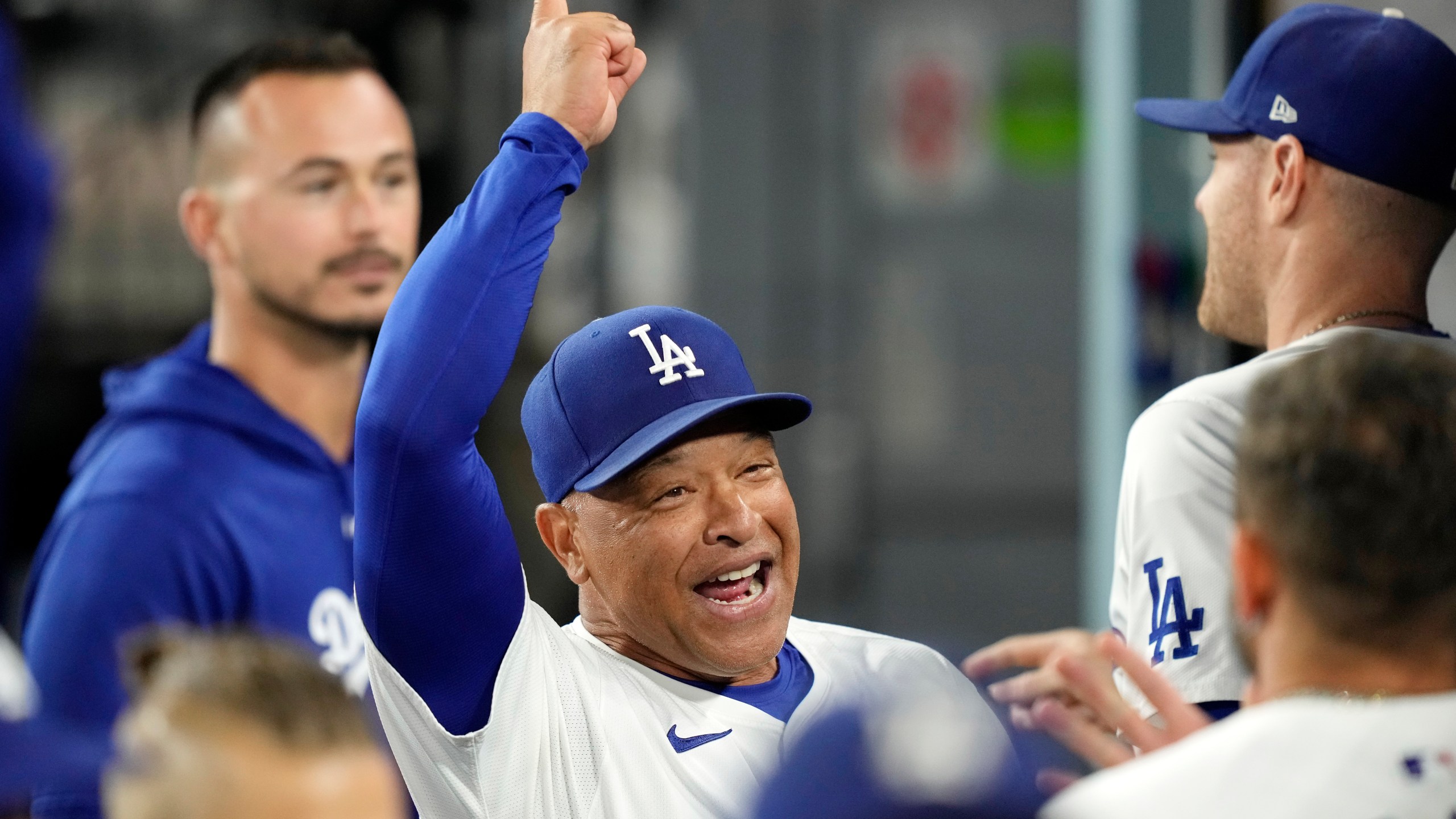 Los Angeles Dodgers manager Dave Roberts gestures to teammates prior to a baseball game against the San Diego Padres, Tuesday, Sept. 24, 2024, in Los Angeles. (AP Photo/Mark J. Terrill)