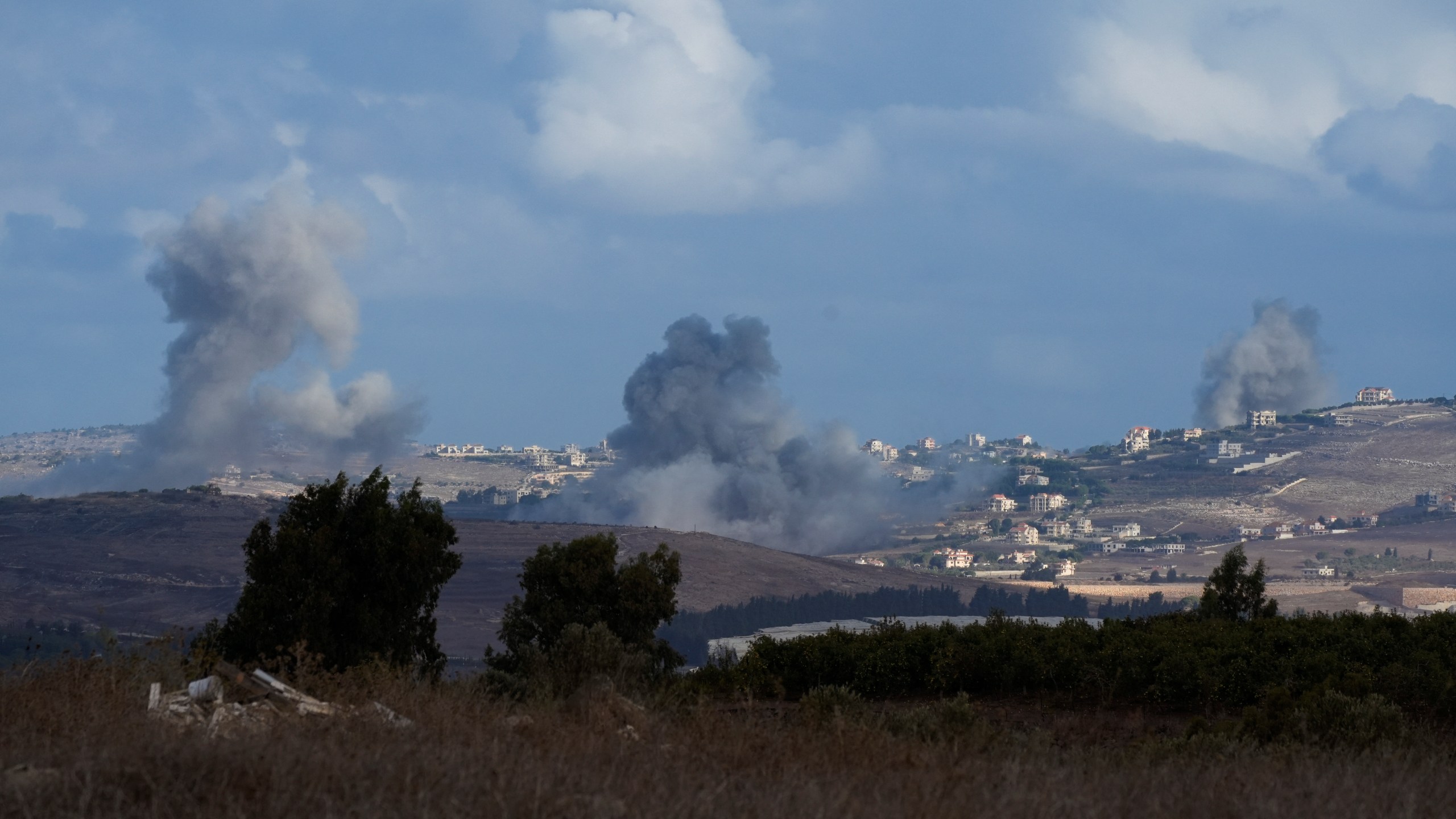 Smoke rises following Israeli bombardment in southern Lebanon as seen from northern Israel, Wednesday, Oct. 2, 2024. (AP Photo/Baz Ratner)