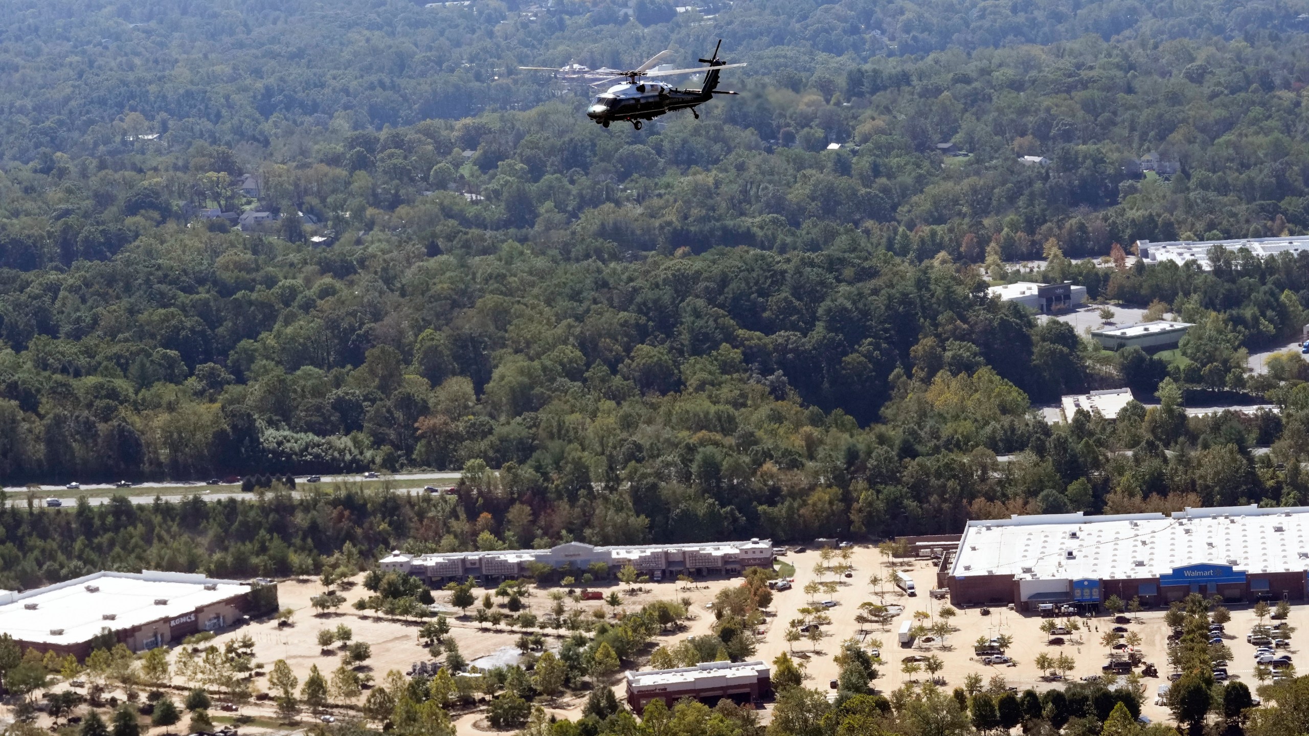 Marine One, with President Joe Biden on board, flies over areas impacted by Hurricane Helene over downtown Asheville, N.C., Wednesday, Oct. 2, 2024. (AP Photo/Susan Walsh) (AP Photo/Susan Walsh)