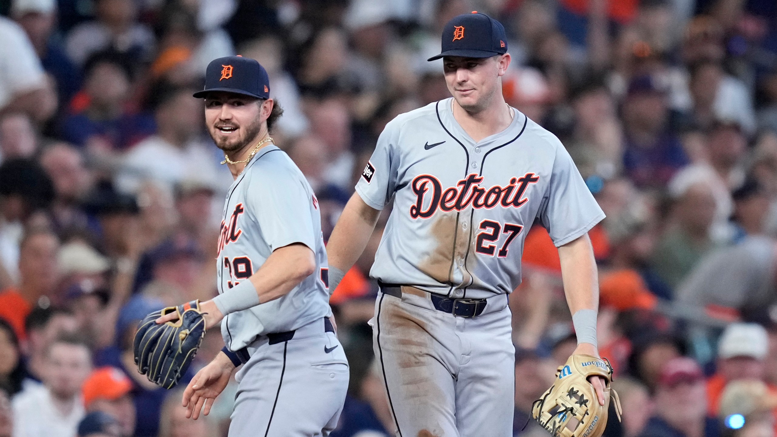 Detroit Tigers third baseman Zach McKinstry (39) and shortstop Trey Sweeney (27) celebrate after completing a double play that off a ground ball by Houston Astros' Yainer Diaz in the sixth inning of Game 2 of an AL Wild Card Series baseball game Wednesday, Oct. 2, 2024, in Houston. (AP Photo/Kevin M. Cox)