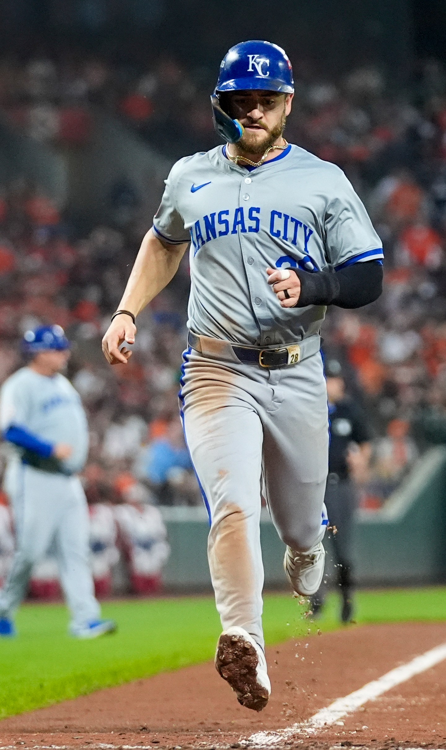 Kansas City Royals' Kyle Isbel scores on an infield single by Bobby Witt Jr. during the sixth inning in Game 2 of an AL Wild Card Series baseball game against the Baltimore Orioles, Wednesday, Oct. 2, 2024 in Baltimore. (AP Photo/Stephanie Scarbrough)