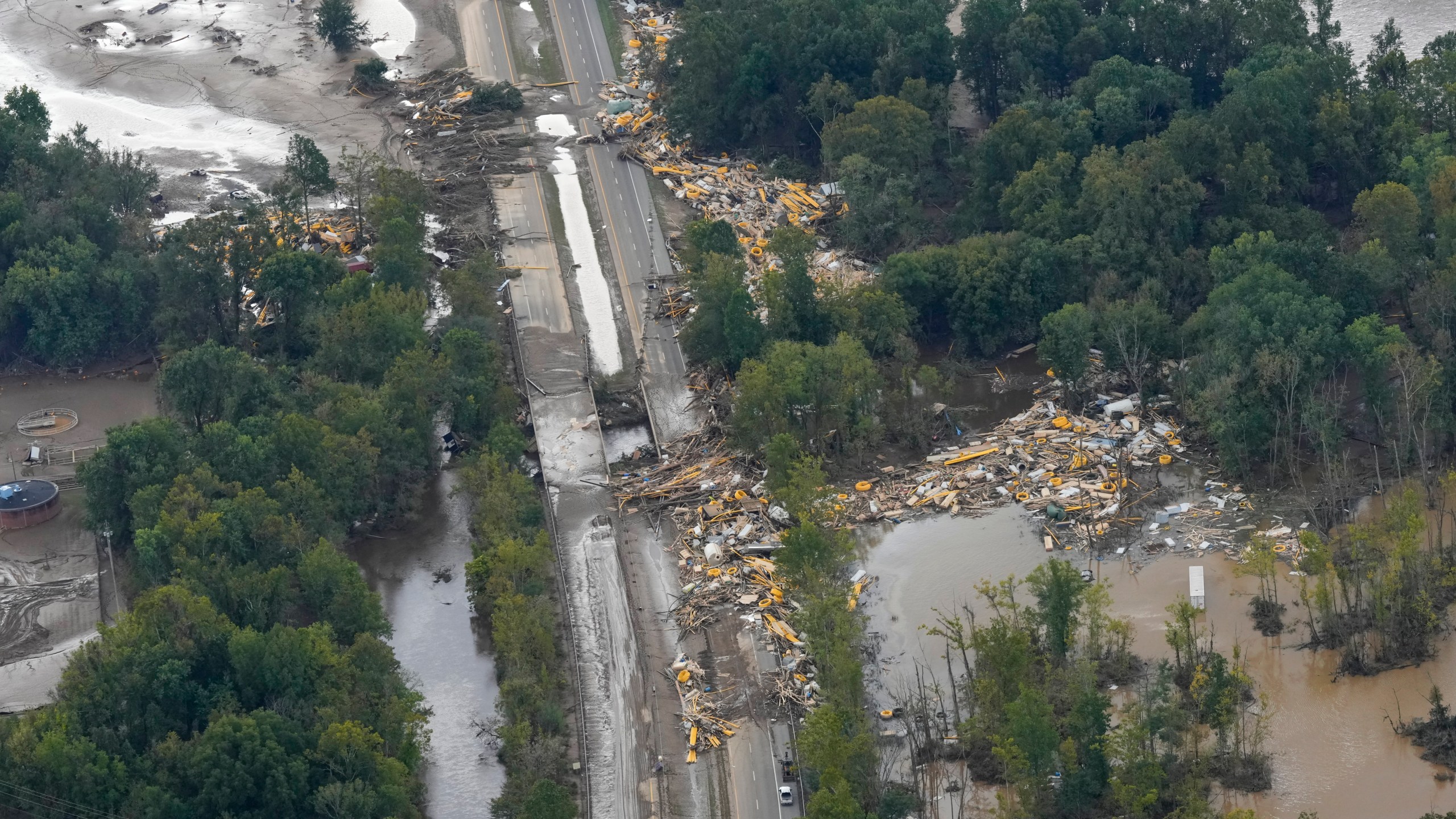 An aerial view of flood damage in the aftermath of Hurricane Helene, Saturday, Sept. 28, 2024, in Erwin, Tenn. (AP Photo/George Walker IV)