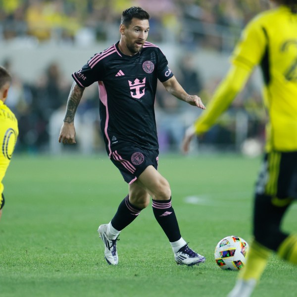 Inter Miami's Lionel Messi, center, tries to dribble between Columbus Crew's Alexandru Matan, left, and Mohamed Farsi during the first half of an MLS soccer match, Wednesday, Oct. 2, 2024, in Columbus, Ohio. (AP Photo/Jay LaPrete)