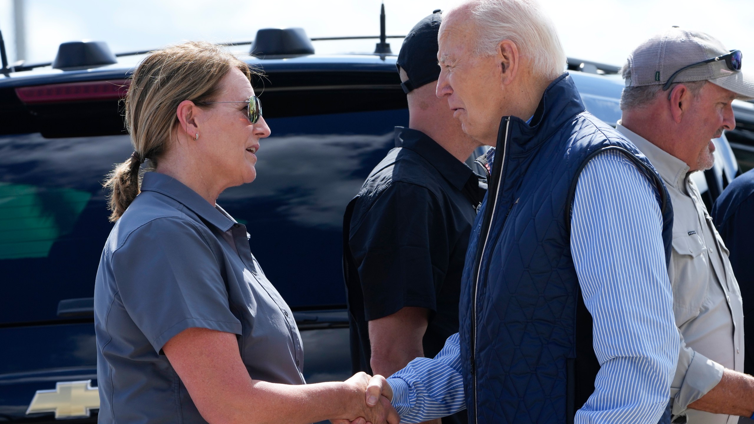 President Joe Biden talks with Deanne Criswell, Administrator of the Federal Emergency Management Agency (FEMA), as he arrives at Greenville-Spartanburg International Airport in Greer, S.C., Wednesday, Oct. 2, 2024, to survey damage from Hurricane Helene. (AP Photo/Susan Walsh)