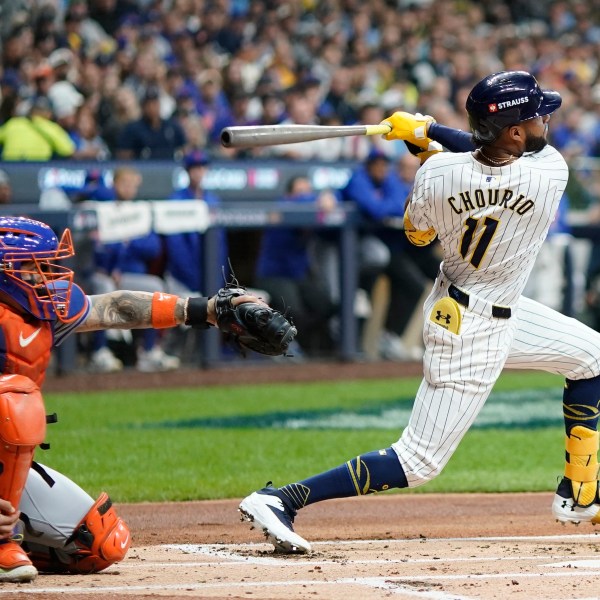 Milwaukee Brewers' Jackson Chourio hits a home run during the first inning of Game 2 of a National League wild card baseball game against the New York Mets Wednesday, Oct. 2, 2024, in Milwaukee. (AP Photo/Morry Gash)