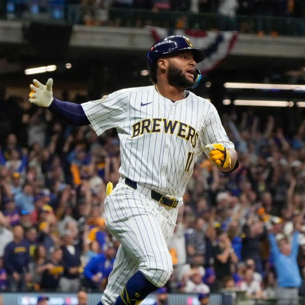 Milwaukee Brewers' Jackson Chourio reacts after hitting a home run during the eighth inning of Game 2 of a National League wild card baseball game against the New York Mets Wednesday, Oct. 2, 2024, in Milwaukee. (AP Photo/Morry Gash)