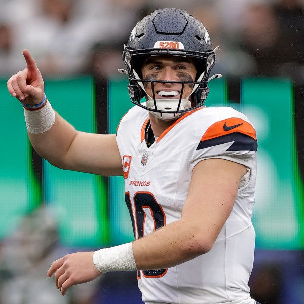 Denver Broncos quarterback Bo Nix (10) reacts after throwing his first touchdown pass against the New York Jets during the third quarter of an NFL football game, Sunday, Sept. 29, 2024, in East Rutherford, N.J. (AP Photo/Adam Hunger)