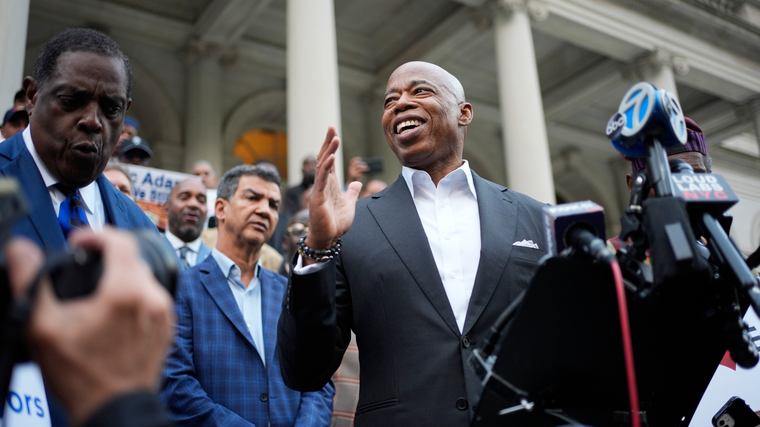 New York City Mayor Eric Adams speaks while surrounded by faith leaders and other supporters during a rally and prayer vigil on the steps of City Hall in New York, Tuesday, Oct. 1, 2024. (AP Photo/Seth Wenig)